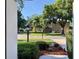 View of a quiet, tree-lined neighborhood street, showing the peaceful surroundings at 1784 Sparkling Water Cir, Ocoee, FL 34761