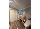 Well-lit bathroom with modern vanity, wood-look tile, and fixtures at 1821 N Reedy Lake Blvd, Frostproof, FL 33843