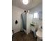 Modest bathroom featuring a standing shower, and standard toilet at 1821 N Reedy Lake Blvd, Frostproof, FL 33843