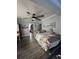 Spacious main bedroom with ceiling fan and closet/storage area at 1821 N Reedy Lake Blvd, Frostproof, FL 33843