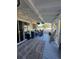 Covered outdoor screened patio with stylish decor at 1821 N Reedy Lake Blvd, Frostproof, FL 33843