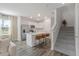 Bright, open-concept kitchen with stainless steel appliances, a center island and a breakfast bar at 185 E Warren Ave, Longwood, FL 32750