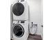 Laundry room with stacked washer and dryer at 185 E Warren Ave, Longwood, FL 32750