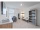Bright office space featuring a comfortable seating area, modern desk and bookcase at 185 E Warren Ave, Longwood, FL 32750