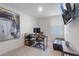 Small office with a desk, computer, artwork and a leather couch at 185 E Warren Ave, Longwood, FL 32750