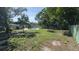 Expansive backyard showcasing the lush greenery, a private pool, and a peaceful outdoor setting at 2074 Dunsford Dr, Orlando, FL 32808