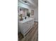 Stylish bathroom featuring a sleek vanity with modern fixtures and a well-lit mirror at 2074 Dunsford Dr, Orlando, FL 32808