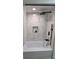 Modern bathroom featuring a soaking tub, with sleek black hardware and contemporary tiled walls at 2074 Dunsford Dr, Orlando, FL 32808