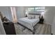 Bright bedroom with a king-size bed, stylish rug, and modern finishes, creating a relaxing atmosphere at 2074 Dunsford Dr, Orlando, FL 32808