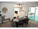 Open dining area with a contemporary light fixture and seamless flow into the living spaces at 2074 Dunsford Dr, Orlando, FL 32808