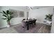 Elegant dining room with modern lighting, stylish decor, and ample seating for entertaining at 2074 Dunsford Dr, Orlando, FL 32808