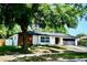 Charming single-story home featuring a brick accent and lush landscaping surrounding the property at 2074 Dunsford Dr, Orlando, FL 32808