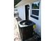 Efficient HVAC system exterior with a modern design and updated window, with convenient access door at 2074 Dunsford Dr, Orlando, FL 32808