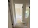 Hallway with wood-look floors leading to the rooms at 2074 Dunsford Dr, Orlando, FL 32808