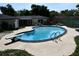 Inviting backyard featuring a pool with a diving board, an outdoor barbecue, and ample space for entertaining at 2074 Dunsford Dr, Orlando, FL 32808
