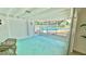 Bright screened lanai with serene pool views, offering a perfect space for relaxation and outdoor enjoyment at 2074 Dunsford Dr, Orlando, FL 32808