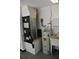 Utility room featuring a water heater, AC unit, sink and storage, offering functionality and organization at 2074 Dunsford Dr, Orlando, FL 32808