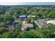 Aerial view of the home in a neighborhood with mature trees at 220 Hillside Dr, Lakeland, FL 33803