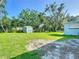 Backyard view with shed and plenty of grassy area at 220 Hillside Dr, Lakeland, FL 33803