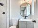 The bathroom has a shower, toilet, sink, mirror, and vanity at 220 Hillside Dr, Lakeland, FL 33803