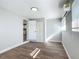 Cozy bedroom featuring new vinyl flooring and a convenient closet at 220 Hillside Dr, Lakeland, FL 33803