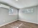 Well-lit bedroom with new vinyl floors and large windows with blinds at 220 Hillside Dr, Lakeland, FL 33803