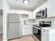 Bright kitchen with stainless steel appliances, plenty of counter space and modern cabinets at 220 Hillside Dr, Lakeland, FL 33803
