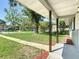 Inviting front porch with wooden supports and a view of the green front yard at 220 Hillside Dr, Lakeland, FL 33803