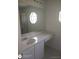 Bathroom with a large mirror, cabinets and an octagon window at 236 Rontunda Dr, Kissimmee, FL 34758