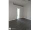 This spacious bedroom has wood floors and a door leading to the bathroom at 236 Rontunda Dr, Kissimmee, FL 34758