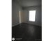 Bedroom featuring wood floors, a large window and ample natural light at 236 Rontunda Dr, Kissimmee, FL 34758