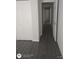 Hallway with wood-look flooring leading to other rooms at 236 Rontunda Dr, Kissimmee, FL 34758