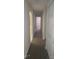 Hallway with wood floors and white doors at 236 Rontunda Dr, Kissimmee, FL 34758