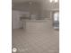 Open kitchen with sleek white cabinetry, modern appliances, and a convenient breakfast bar at 236 Rontunda Dr, Kissimmee, FL 34758