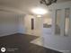 Open-concept living area with modern flooring, architectural columns, and abundant natural light at 236 Rontunda Dr, Kissimmee, FL 34758