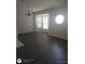 Cozy living room with wood floors and a bay window at 236 Rontunda Dr, Kissimmee, FL 34758