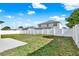 Spacious backyard with a privacy fence, offering a blank canvas for creating your dream outdoor oasis at 242 Anson Dr, Kissimmee, FL 34758