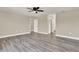 Neutral bedroom showcasing light gray floors and white trim throughout at 242 Anson Dr, Kissimmee, FL 34758
