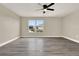 Neutral paint and modern gray floors create a serene space in this bedroom at 242 Anson Dr, Kissimmee, FL 34758