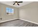 This bedroom offers lots of natural light and modern ceiling fan and beautiful flooring at 242 Anson Dr, Kissimmee, FL 34758