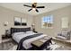 This bedroom has a sleek, modern design with a large window for natural light at 242 Anson Dr, Kissimmee, FL 34758