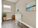 Laundry room with utility sink, modern artwork, and ample space at 242 Anson Dr, Kissimmee, FL 34758