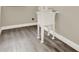 Functional laundry room area with utility sink, wood-look flooring, and neutral tones at 242 Anson Dr, Kissimmee, FL 34758