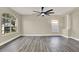 Inviting living room enhanced by expansive windows, trendy flooring, and a neutral color palette for versatile styling at 242 Anson Dr, Kissimmee, FL 34758
