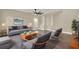 Bright living room with gray sofa, high ceilings, and lots of natural light at 242 Anson Dr, Kissimmee, FL 34758