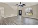 Grand living room featuring high ceilings, contemporary flooring, and a bright, airy ambiance near the home's entrance at 242 Anson Dr, Kissimmee, FL 34758