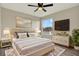 Stylish main bedroom with elegant decor, mounted television, and bright windows at 242 Anson Dr, Kissimmee, FL 34758