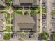 Aerial view showing townhouse exteriors with landscaping, parking and building layout at 2614 Lodi Cir # 106, Kissimmee, FL 34746
