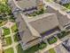 Overhead view of townhouse exteriors showcasing landscaping and street at 2614 Lodi Cir # 106, Kissimmee, FL 34746