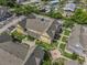 Aerial view of townhouse complex showcasing the building, parking, and landscaping at 2614 Lodi Cir # 106, Kissimmee, FL 34746